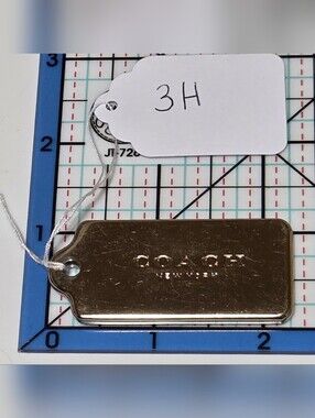 COACH Gold Metal Logo Plate